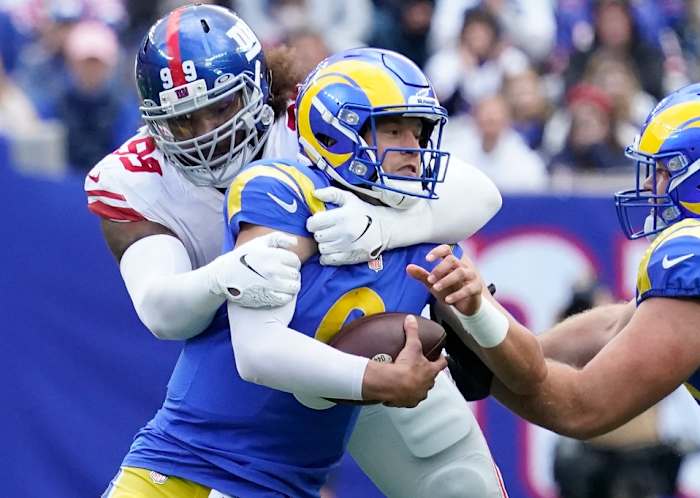 Oct 17, 2021; East Rutherford, New Jersey, USA; New York Giants defensive end Leonard Williams (99) wraps up Los Angeles Rams quarterback Matthew Stafford (9) for a sack in the 1st half at MetLife Stadium.